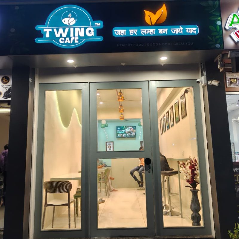 Twing Cafe outlet storefront with illuminated sign on Kuvadva Road, Rajkot